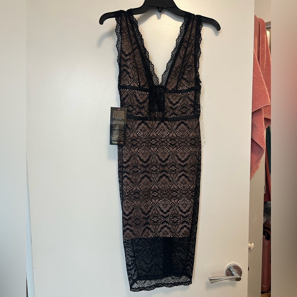 BEBE Women’s black lace up midi dress